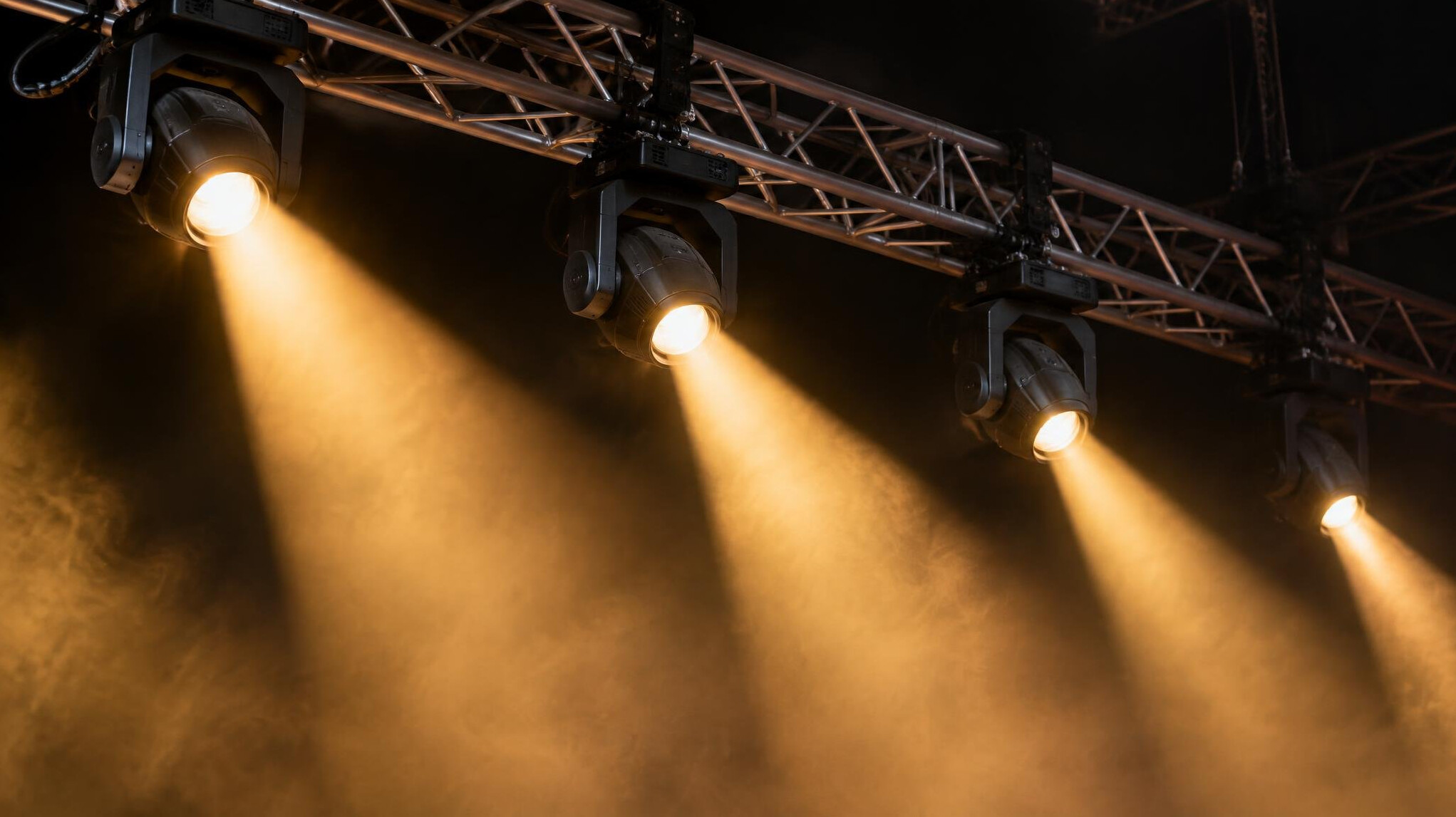 Stage lighting rig with bright beams