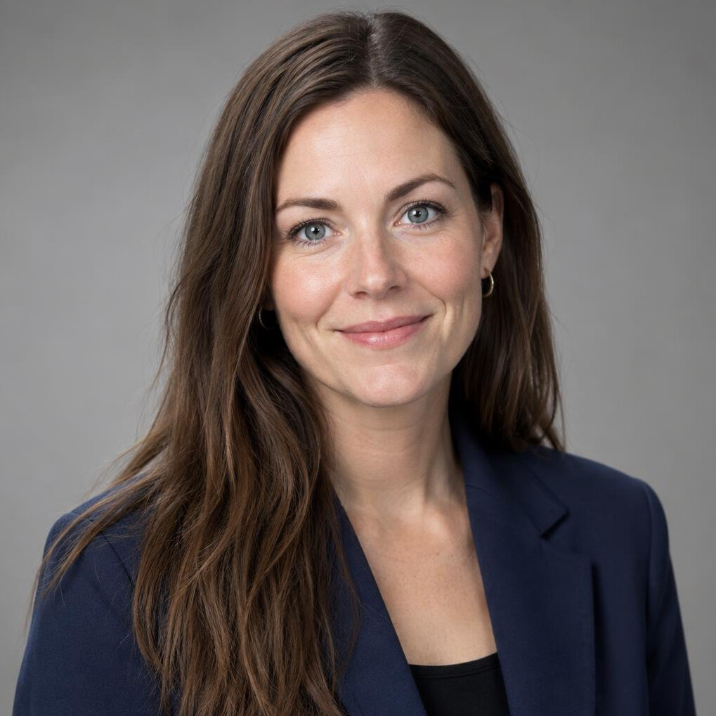 Portrait of a woman with long hair in a blazer